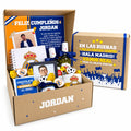 Pack de regalo en caja de cartón con tazas, dulces, cervezas, portaretrato, blocks y chocolates. Regalo personalizado de temática real madrid